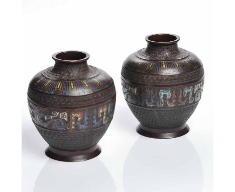 PAIR OF 20TH CENTURY CHINESE BRONZE AND ENAMEL VASES
with stylised tao tie motifs, 19cm high 