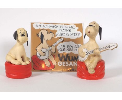 FIGUREN, Konvolut von 2, Herst. Goebel/ Rödental, Gummi, polychromiert, Loriots Wum Hund auf Kissen, dieser beweglich und Git