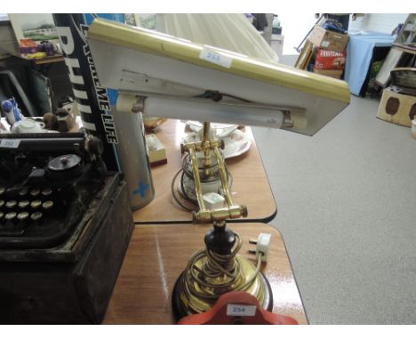 A vintage style brass bodied and treen base desk top lamp