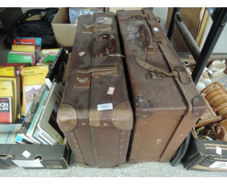 A set of two vintage leather bound travel trunk and suitcase