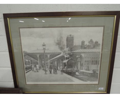 A monochrome print depicting Ulverston station 1908, signed and numbered 3/175 John S Gibb