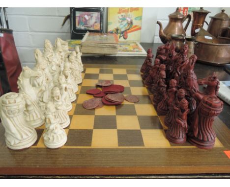 A resin cast chess set with mythical style pieces and treen board