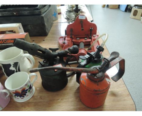 A selection of oil cans and pipe clamp cutter