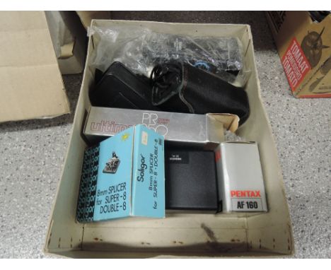A selection of photographic film and camera equipment including Kiron Macro lens