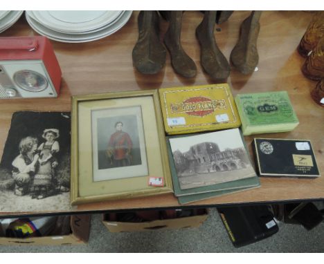 A selection of vintage cigarette advertising cases and selection of prints