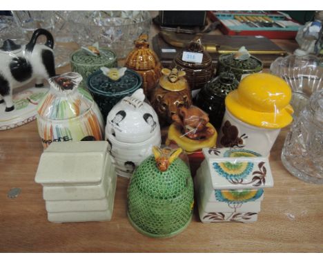 A selection of vintage ceramic honey pots lidded jars and containers including unusual Beatles print