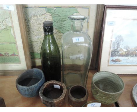 A selection of studio pottery and vintage advertising bottle