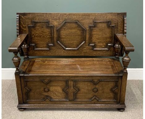 GOOD JACOBEAN-STYLE OAK MONK'S BENCH, having applied moulding to the back and lower panels, carved urn supports to the arms, 