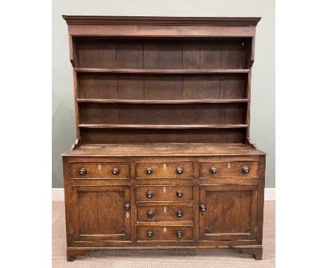 NORTH WALES OAK WELSH DRESSER CIRCA 1850, with a wide boarded back three shelf rack, on a panel sided base section of three f