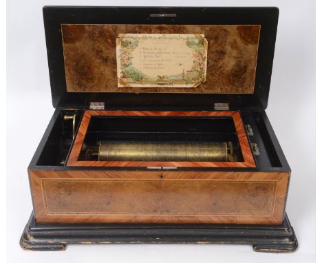 A Thomas Dawkins & Co music box, the 33.5 cm cylinder playing six airs, the governor bracket stamped with a sphinx, 66 cm wid