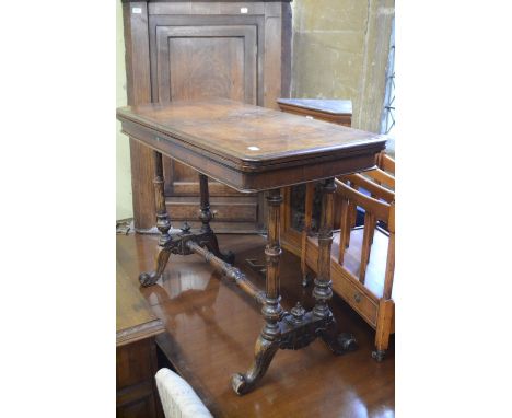 A Victorian walnut card table, 93 cm wide, an oak two door cupboard, a mahogany twin pillar dining table, 310 cm wide, two co