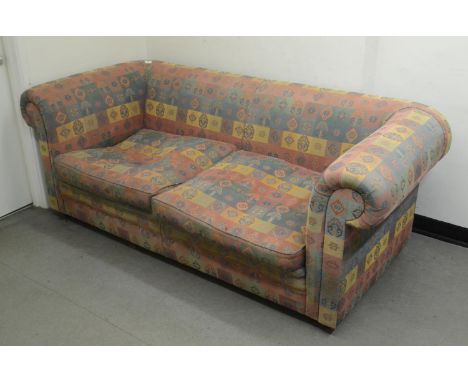 A three seater sofa, and a matching ottoman (2) 