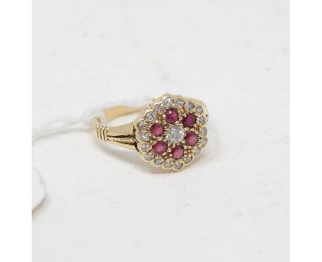 A yellow coloured metal, ruby and diamond cluster ring, approx. ring size N 