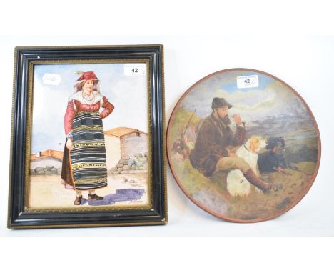 A 19th century tile, painted a full length portrait of a lady, indistinctly signed, 24 x 19 cm, and a Watcombe pottery charge