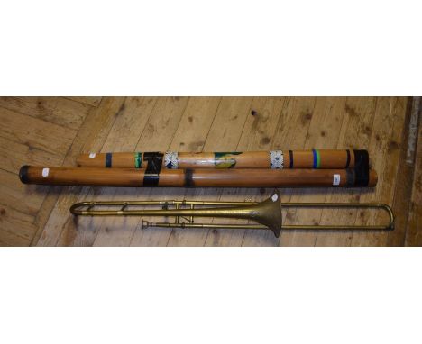A didgeridoo, a rainstick and a Higham Paragon trombone (3) 