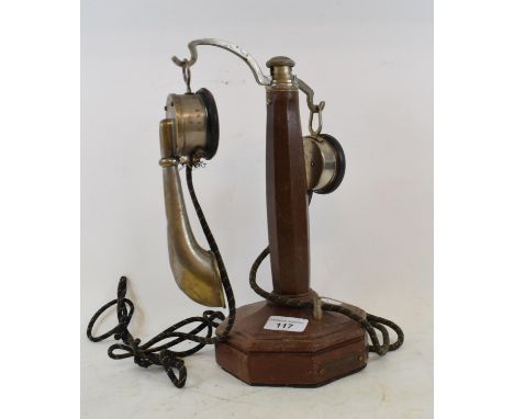 A French Grammont candlestick telephone, circa 1900, having an octagonal walnut column, makers plaque to base, 35 cm high 