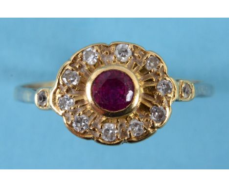 An 18ct gold, ruby and diamond cluster ring, approx. ring size T See inside front cover colour illustration 