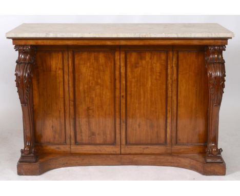 A mahogany console table/cabinet, the marble top above a pair of panel doors, flanked by panels and leaf carved cabriole legs