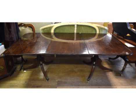 A Regency twin pillar mahogany dining table, with an extra leaf, 213 cm wideRemoved from a Somerset country house 