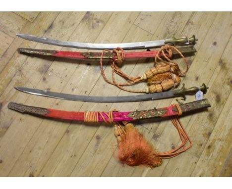 An Indian sabre, in a brass mounted and plush scabbard, and another similar (2) 