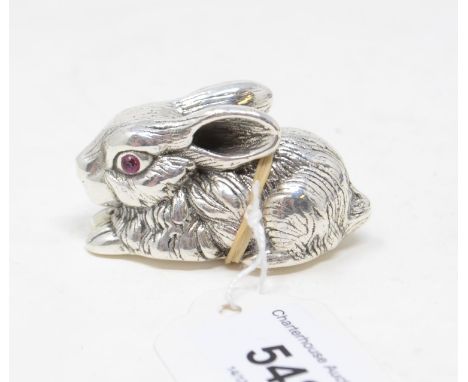 A silver novelty rabbit, set with ruby eyes, 3 cm highModern 