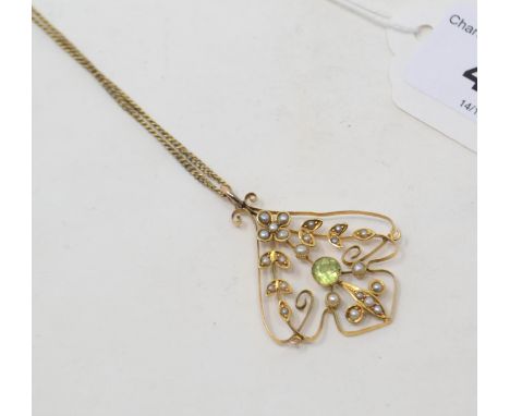 An Art Nouveau yellow coloured metal, peridot and seed pearl pendant, on a 9ct gold chain 