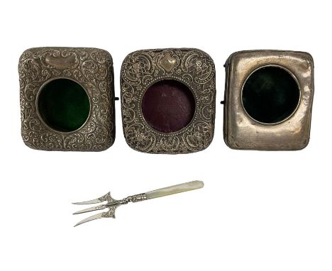 Three silver mounted watch cases and a further hallmarked silver item
