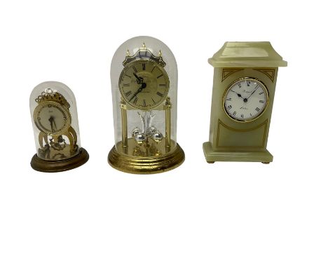 Two contemporary battery driven quartz mantle clocks and a spring driven balance wheel clock
