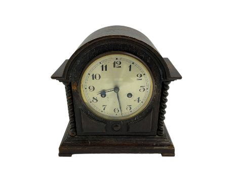 Striking mantle clock in an oak case