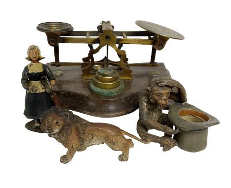 Morden &amp; Co set of bras postal scales, together with three metal painted figures, comprising lion, monkey with a hat and 