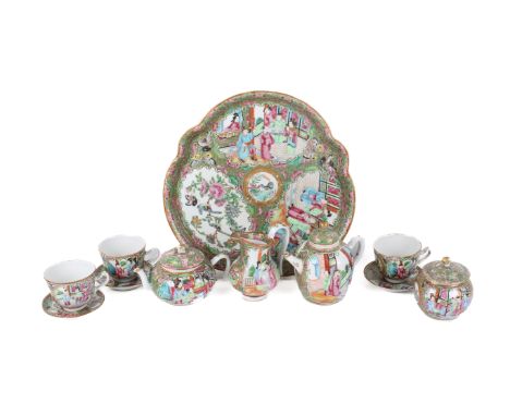 A Chinese circa 1900 Canton matched tea service. Comprising matching small teapot, lidded sugar bowl, milk jug, three cups, o
