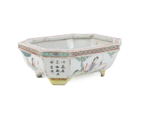 A 19th century Chinese octagonal planter. With a red keyfret border to the rim, the body decorated with four scenes of ladies