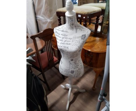 A SHOP MANNEQUIN ON PEDESTAL BASE