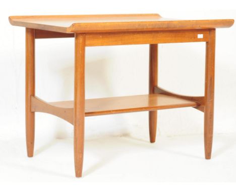 A retro vintage mid 20th century circa. 1970's two tier teak coffee table with galleries to edge. With lower magazine rack / 