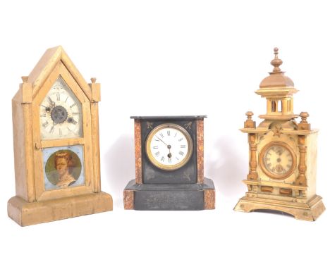 A collection of three vintage 20th century mantel clocks. Comprising of a Bavarian wood carved clock, a Victorian gothic cath
