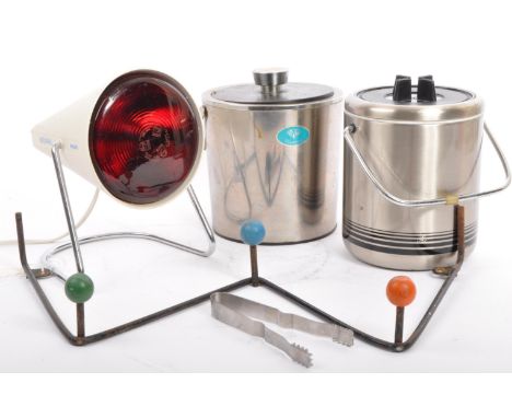 A retro vintage mid 20th century atomic style coat rack, two chrome lidded ice bucket and a infraphil heat lamp.