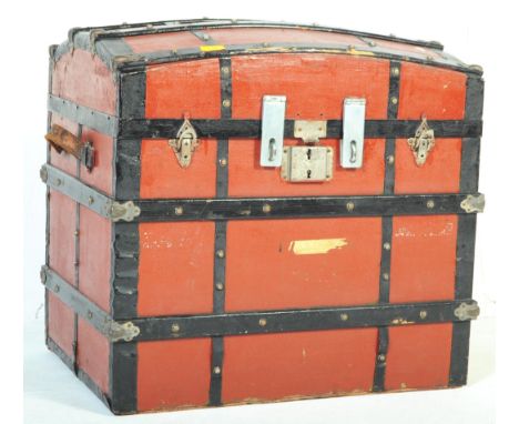 Vintage 20th century dome top steamer travel trunk chest. Of rectangular form with twin leather carry handles, brass mount wi