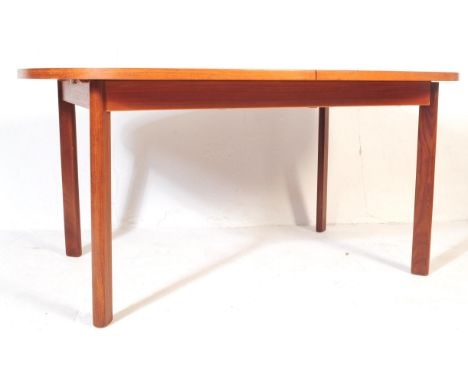 A retro vintage mid 20th G Plan teak wood extending dining table. Of rectangular curved form with shaped upright supports. Me