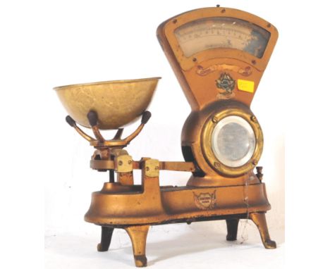 A retro vintage industrial mid century grocers / confectionery shop scales having gold enamel original finish and brass weigh