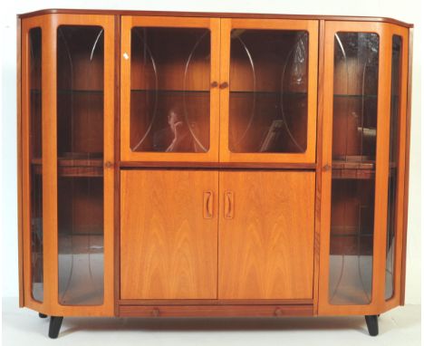 G Plan - Retro vintage mid 20th century teak display bookcase capital. Of rectangular bow front form with twin glazed door to