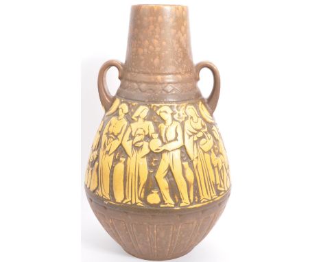 A vintage retro 20th century West German ceramic pottery twin handled amphora vase decorated with hand relief carved decorati