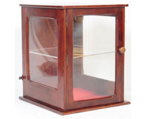 An early to mid 20th Century mahogany framed and glass panelled shop counter display cabinet / counter of square form with si