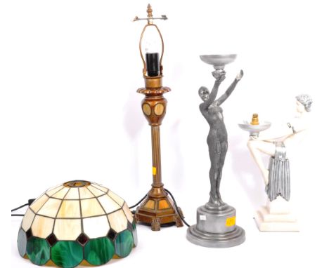 A collection of three vintage 20th century table lamp light bases. Including; female nude leant back holding the light, anoth