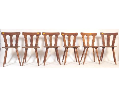 A set of six retro vintage mid 20th century elm bistro kitchen dining chairs. With three curved planked back rest on a saddle
