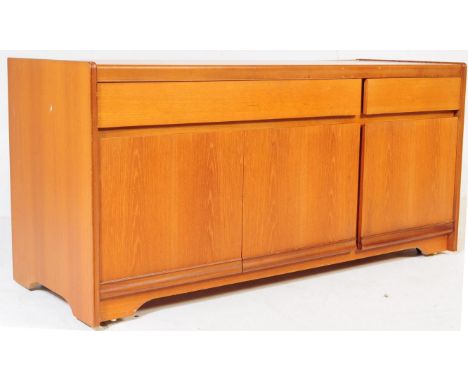 A retro vintage mid 20th century teak sideboard. Of rectangular form with recessed handles with two drawers over three cupboa
