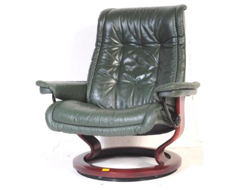 Ekornes Stressless - A vintage original reclining arm chair in green leather and mahogany base. Makers mark stamp to adjuster