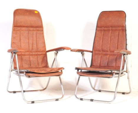 A pair of vintage 20th century metal folding garden lawn chairs. With tubular metal frame with leatherette cushioned back res