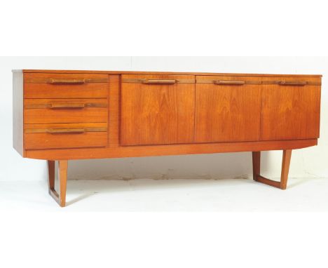 A retro vintage 20th century teak Danish sideboard credenza. Of rectangular form with bank of three drawers to left, three cu