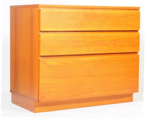 A vintage retro mid 20th century Danish inspired teak wood blind front chest of drawers having recessed grab rail drawers. Me