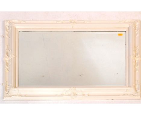 A large retro vintage mid 20th century wooden framed wall mirror. The frame being painted white and in rectangular form, with